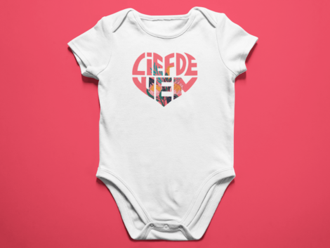 baby-onesie-lying-on-a-white-surface-mockup-a14054--2-min